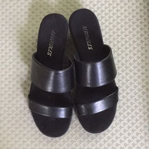 Strap sandals w/ 2” wedge heel & cushioned sole.